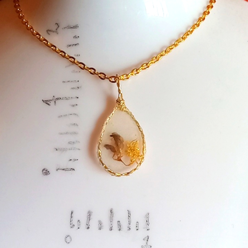 Floral necklace, amulet